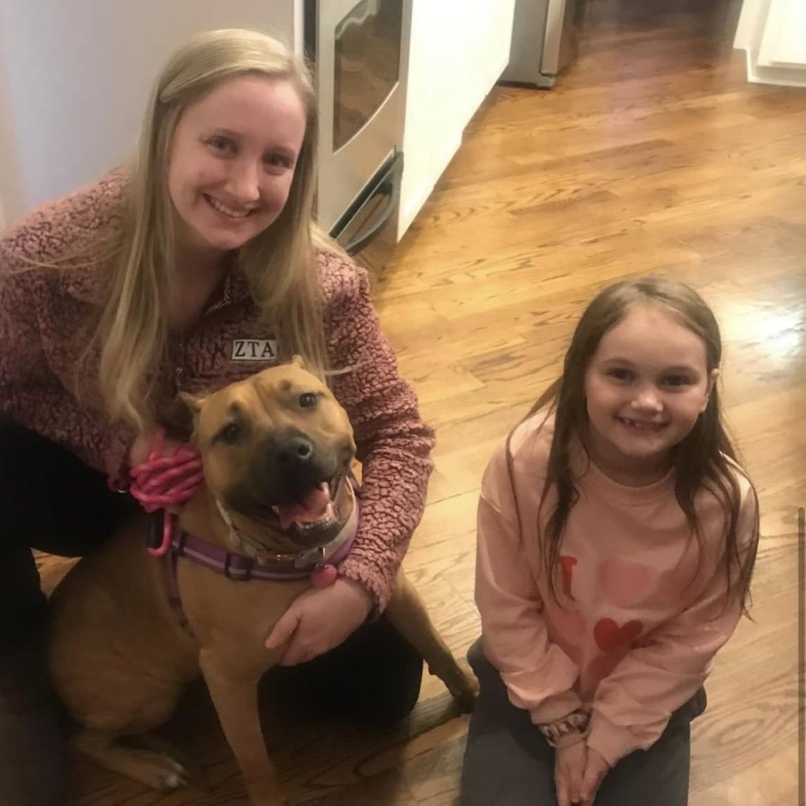 Mother and daughter with dog